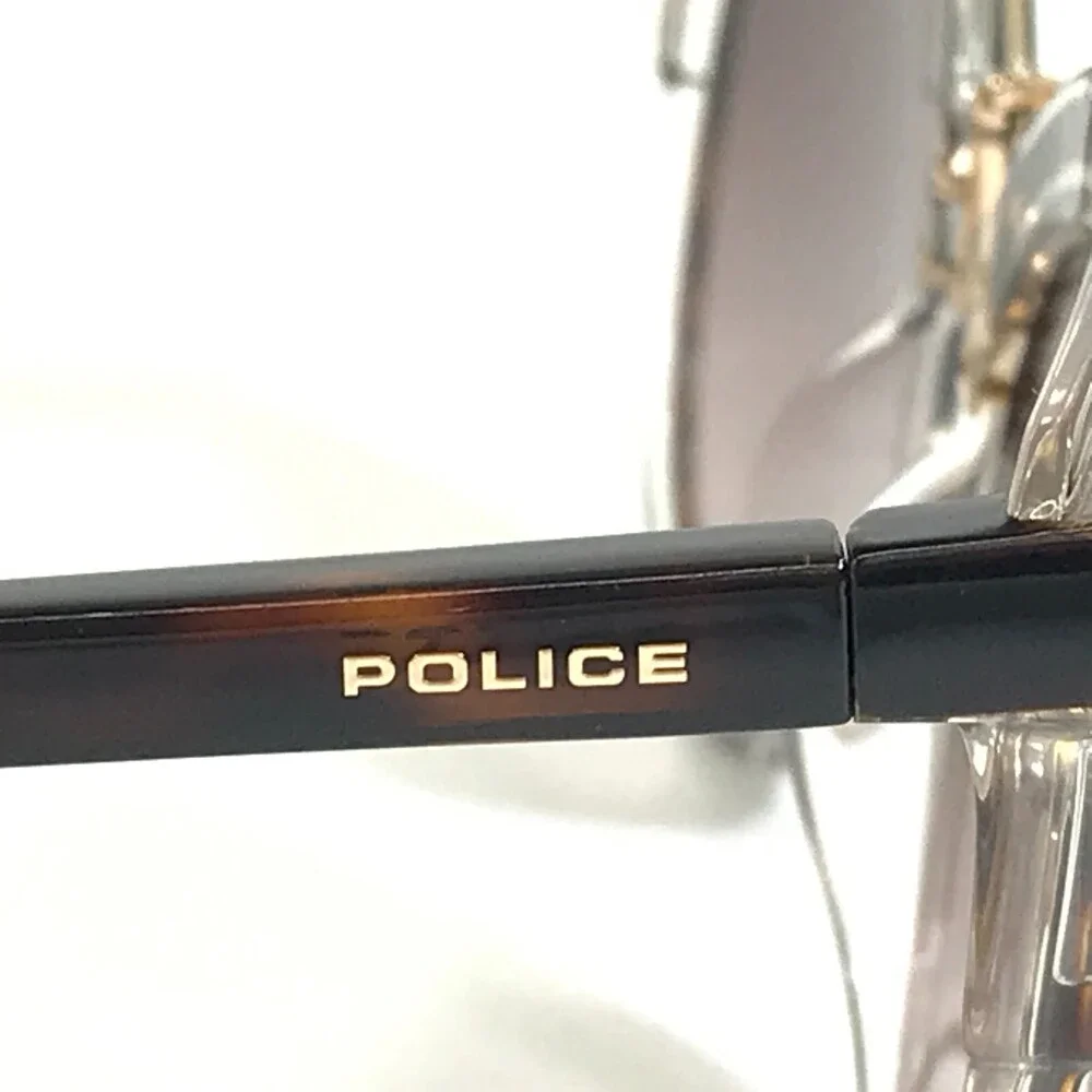 Police Sunglasses SPL 642 COL. 09AX Clear Tortoise Round Frames w/ Purple Lenses